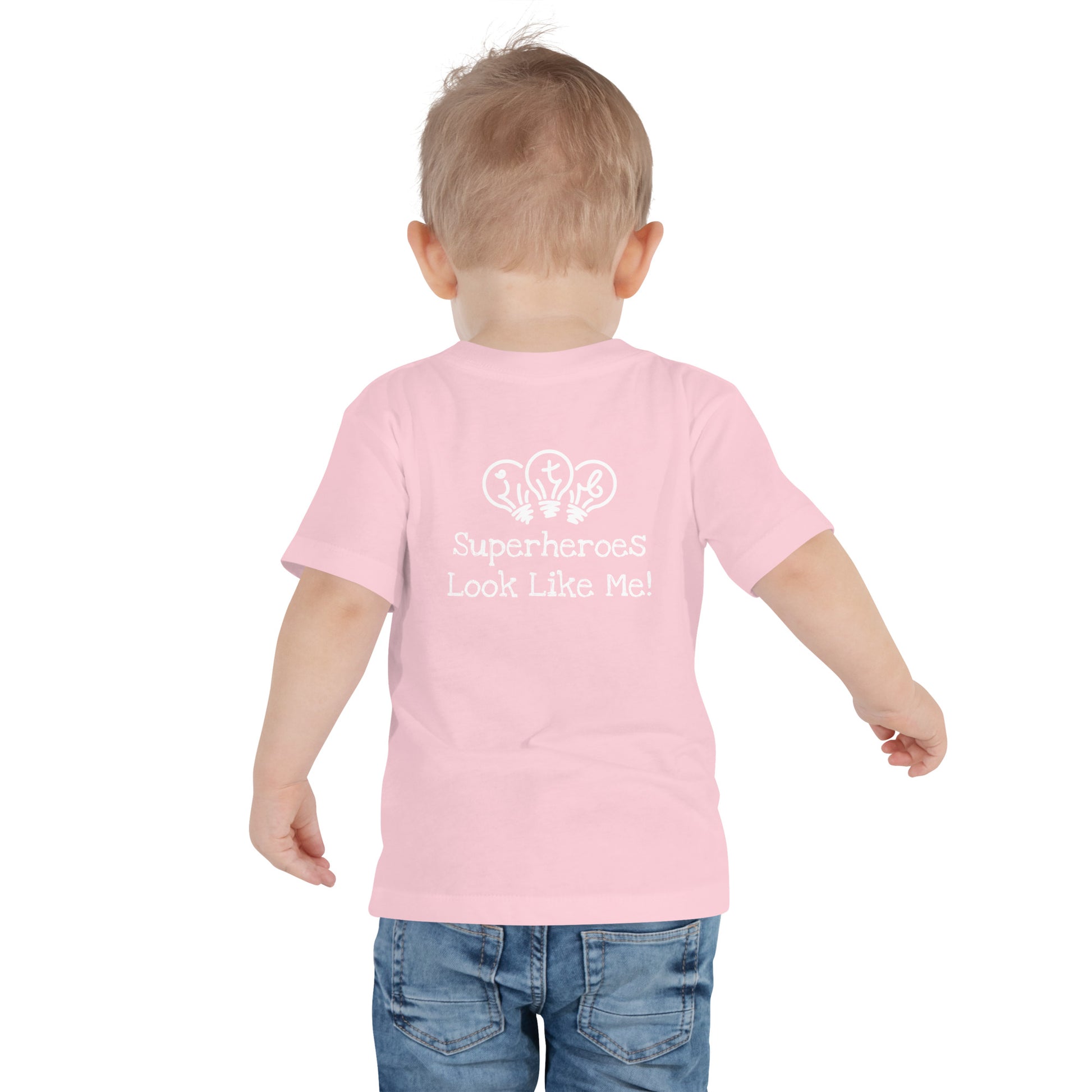 Pink toddler t-shirt with an image of the main character from Crystel Patterson's "Superheroes Here and There" wearing a cape (front) and the text "Superheroes Look Like Me" (back).