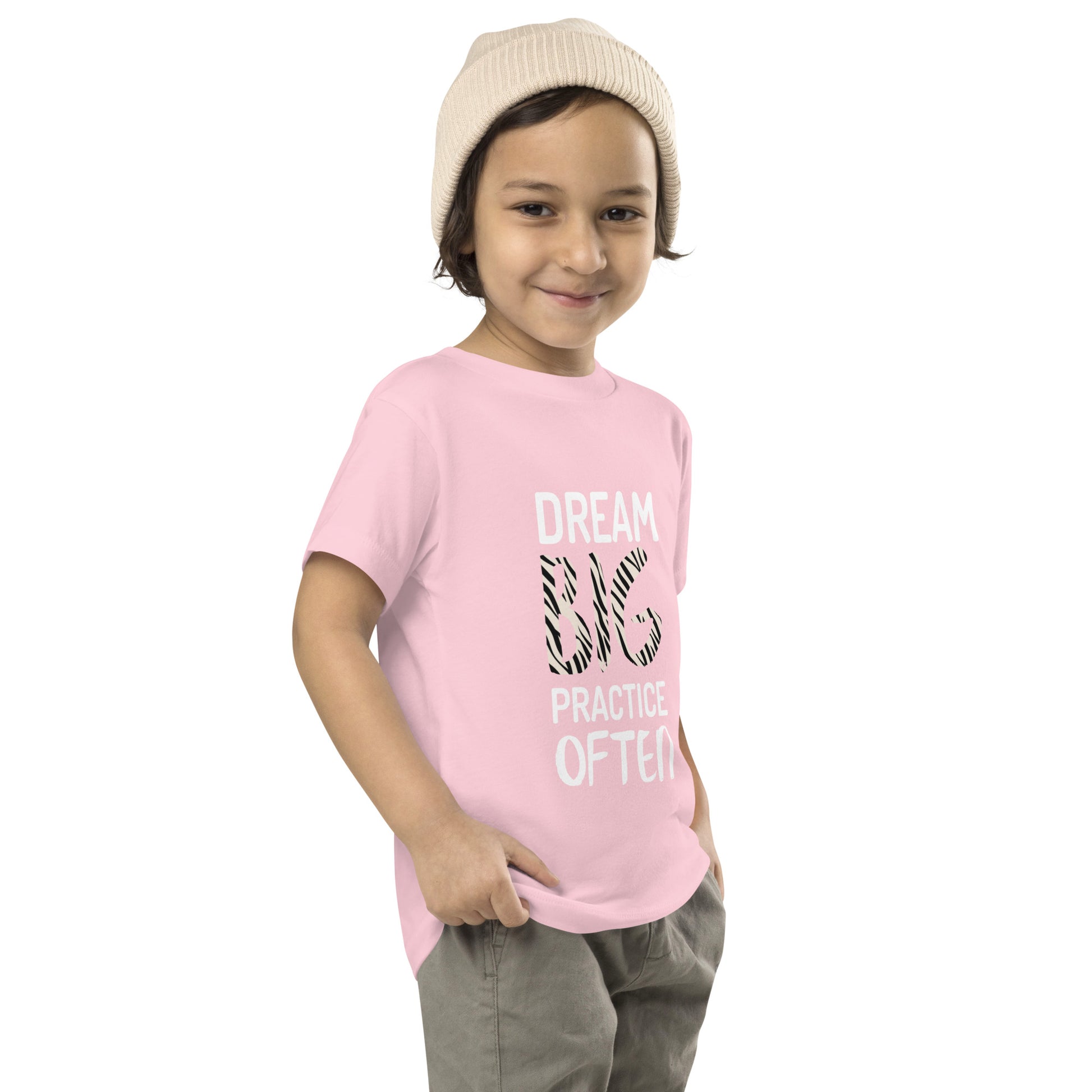 Pink toddler t-shirt featuring the phrase "Dream Big, Practice Often".