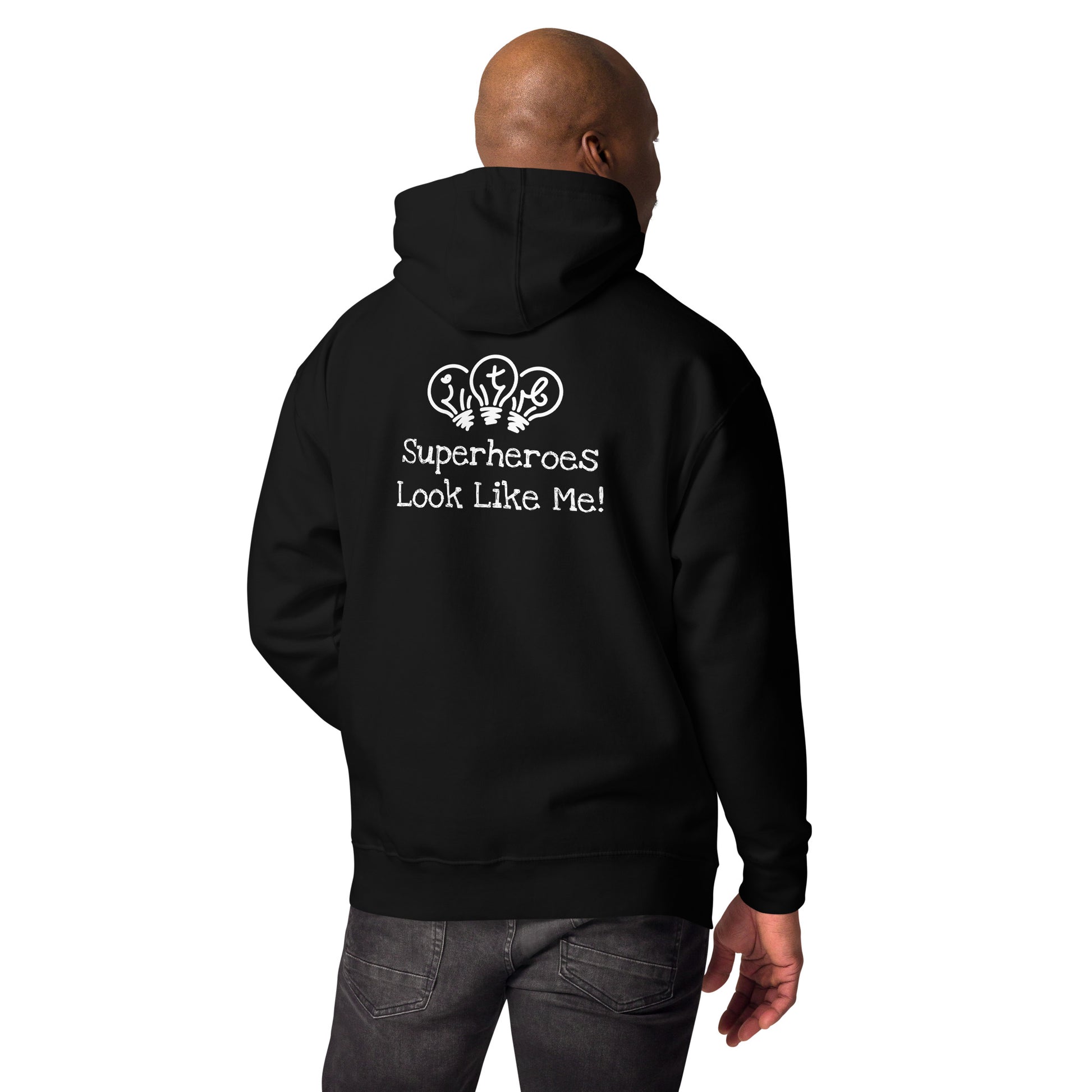 Black adult unisex hoodie with an image of the main character from Crystel Patterson's "Superheroes Here and There" wearing a cape (front) and the text "Superheroes Look Like Me" (back).