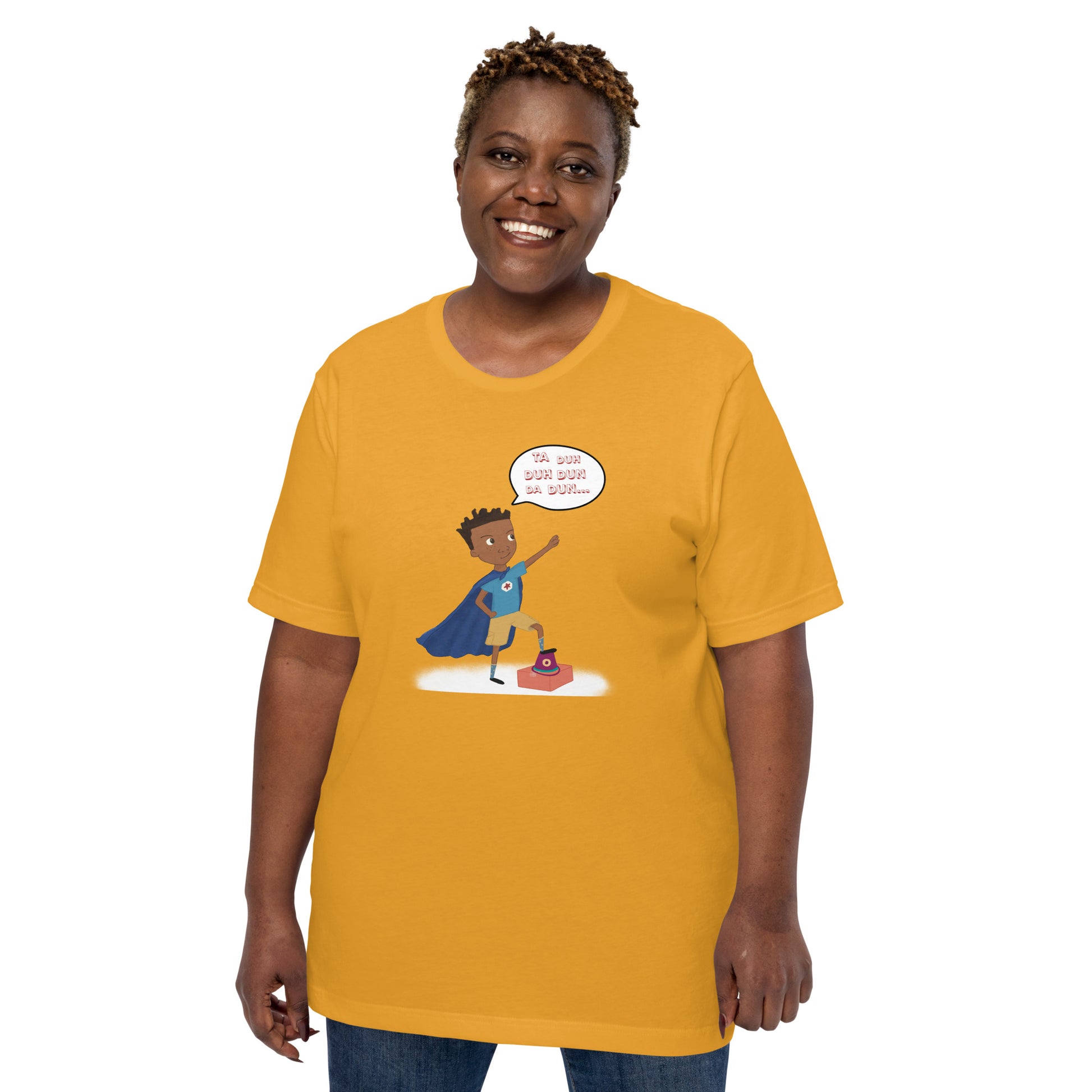 Mustard adult unisex t-shirt with an image of the main character from Crystel Patterson's "Superheroes Here and There" wearing a cape (front) and the text "Superheroes Look Like Me" (back).