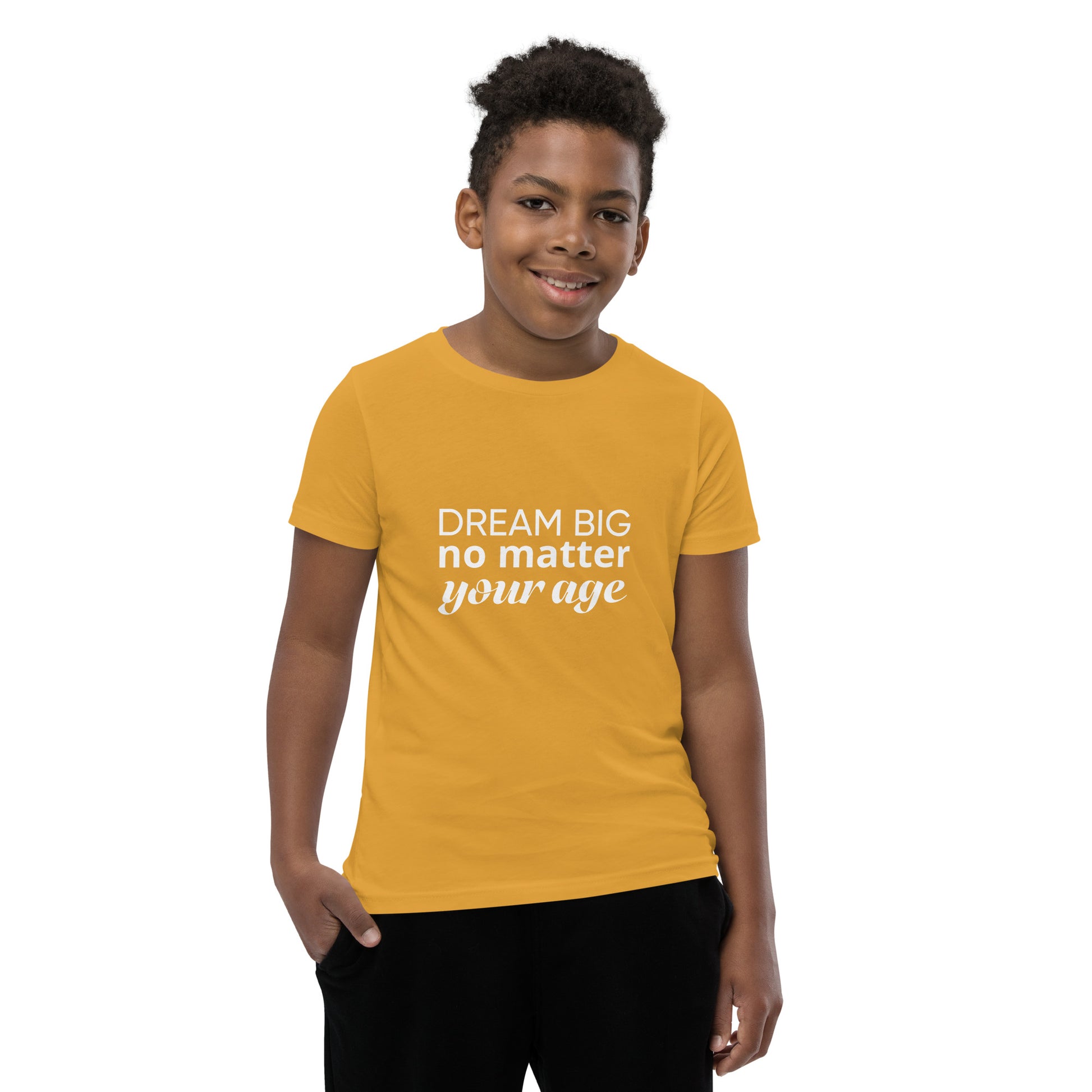 Mustard youth t-shirt showcasing the message "Dream Big No Matter Your Age".