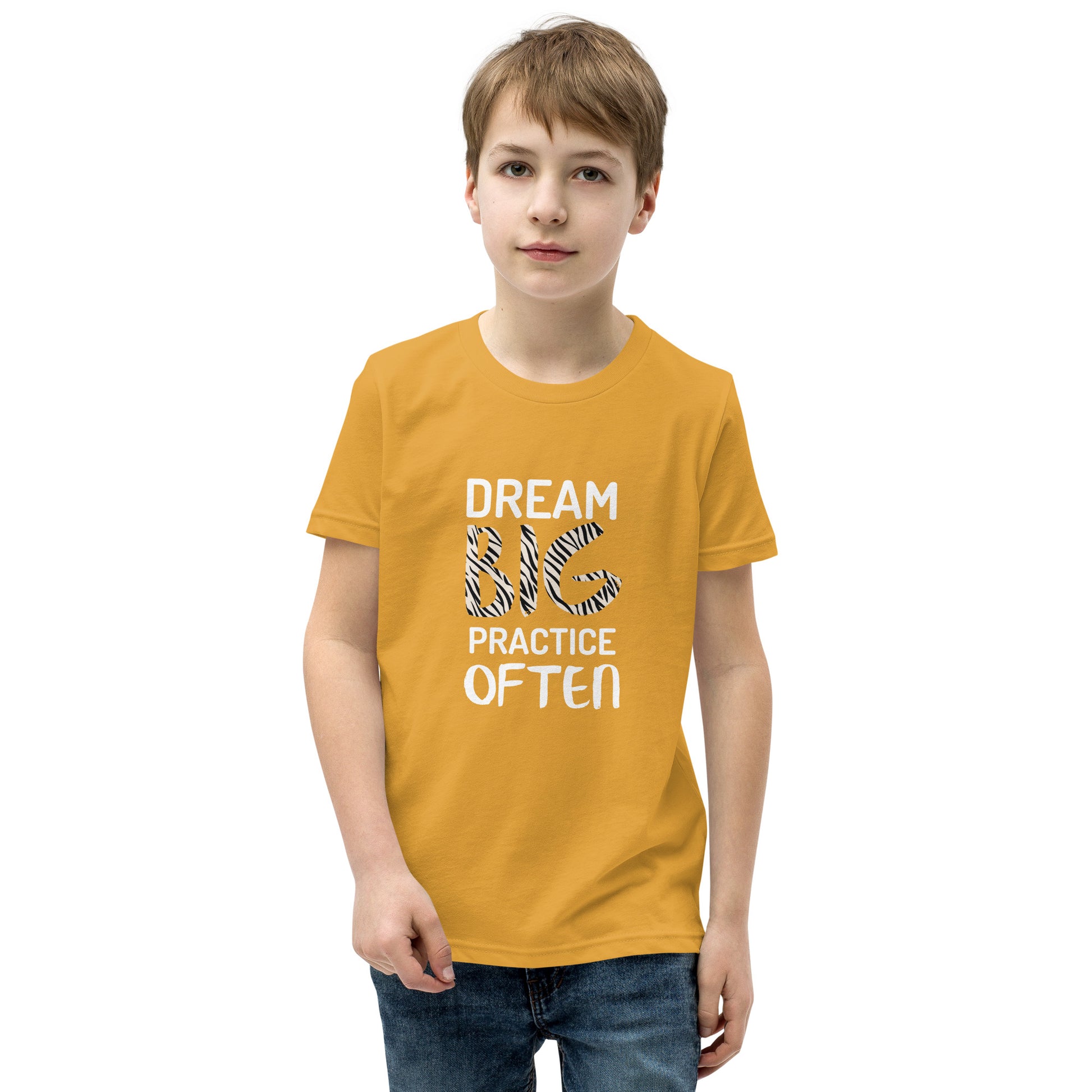 Mustard youth t-shirt featuring the phrase "Dream Big, Practice Often".