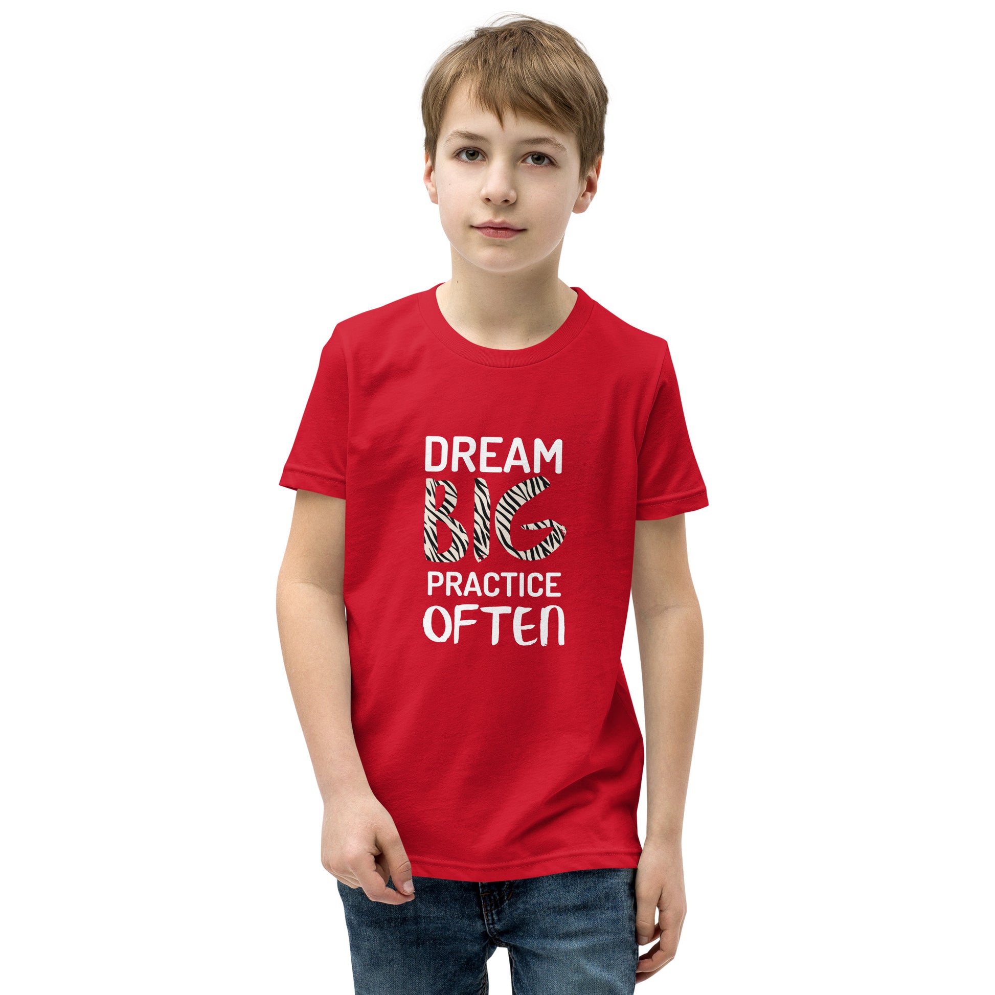 Red youth t-shirt featuring the phrase "Dream Big, Practice Often".