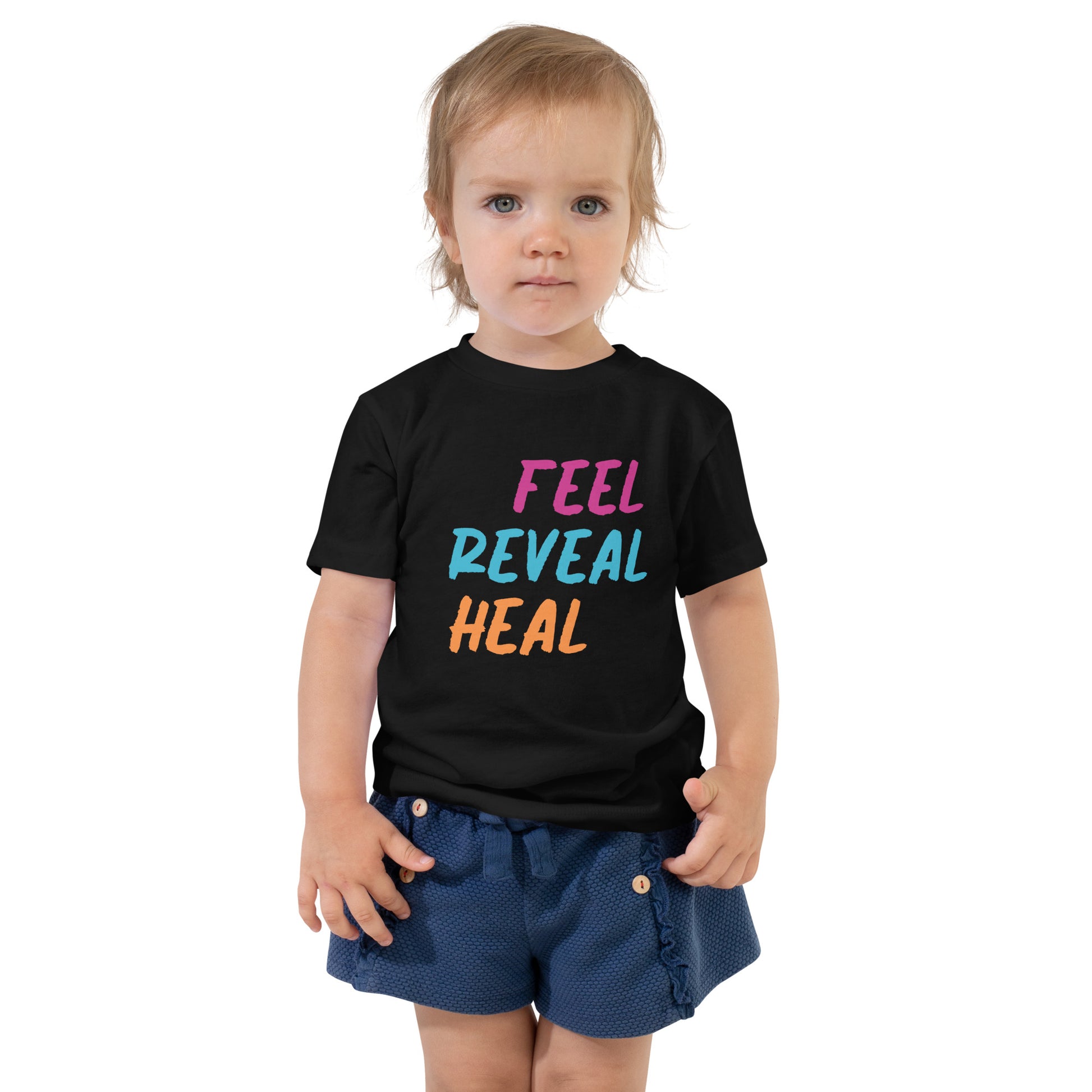 Black toddler t-shirt with the phrase "Feel, Reveal, Heal".