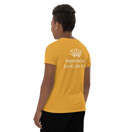 Mustard youth t-shirt with an image of the main character from Crystel Patterson's "Superheroes Here and There" wearing a cape (front) and the text "Superheroes Look Like Me" (back).